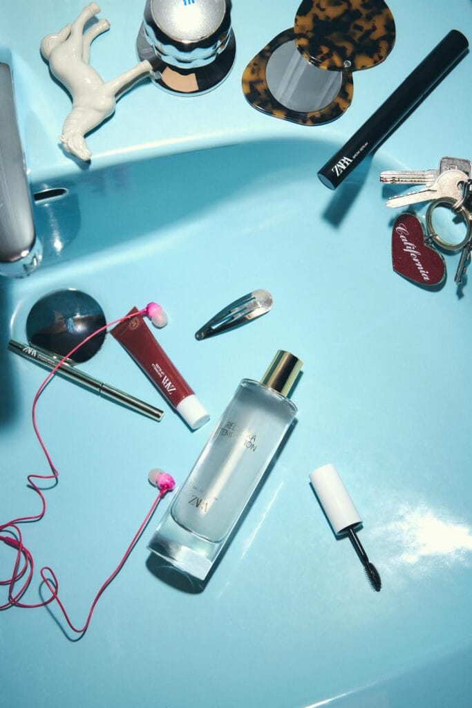flatlay featuring zara red temptation along with other zara makeup products